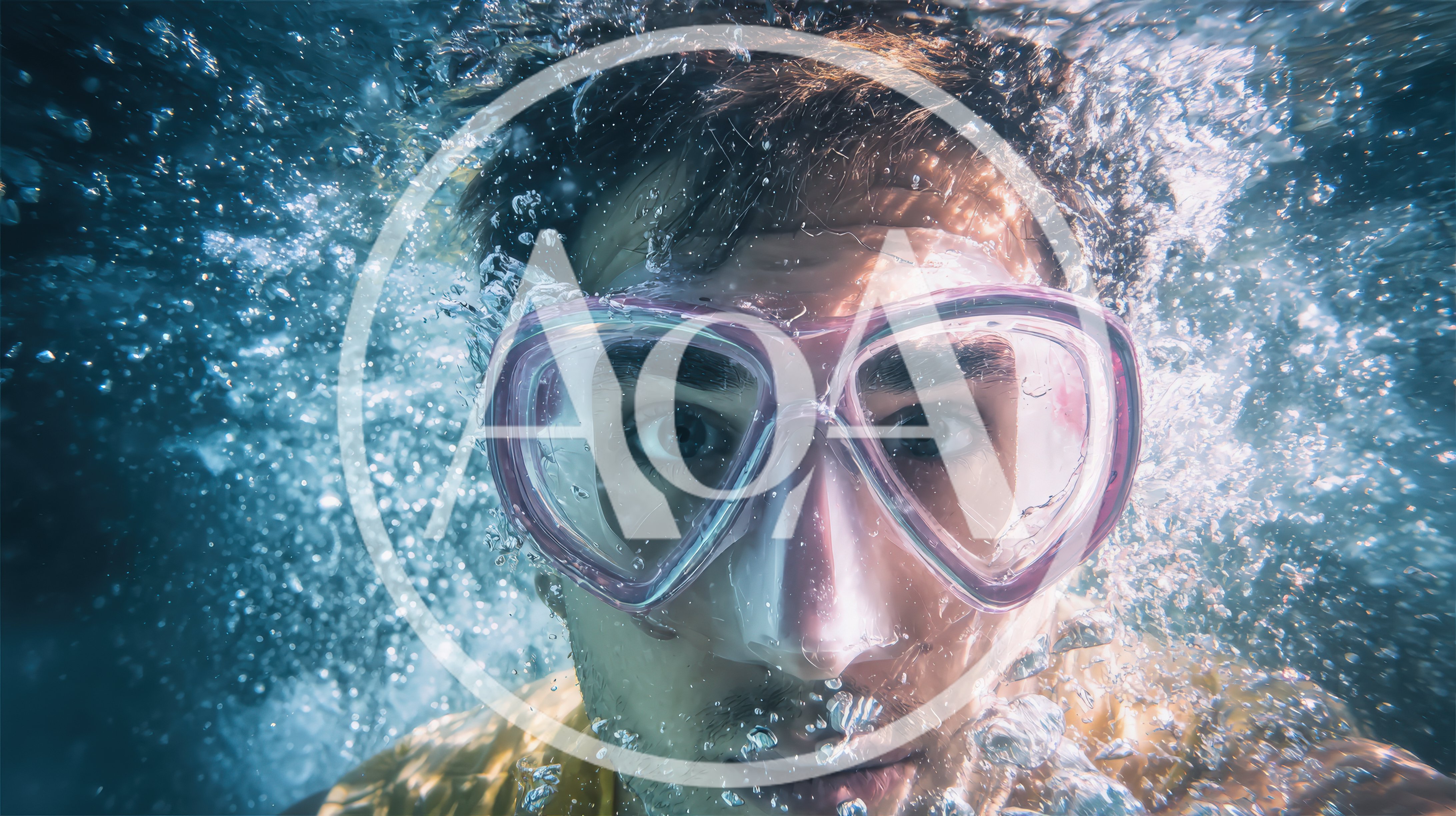 Young Man Swimming Underwater Wearing Snorkeling Mask