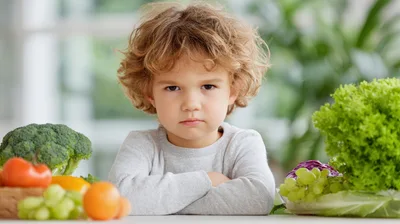Stubborn Young Boy Refusing To Eat Healthy Vegetables