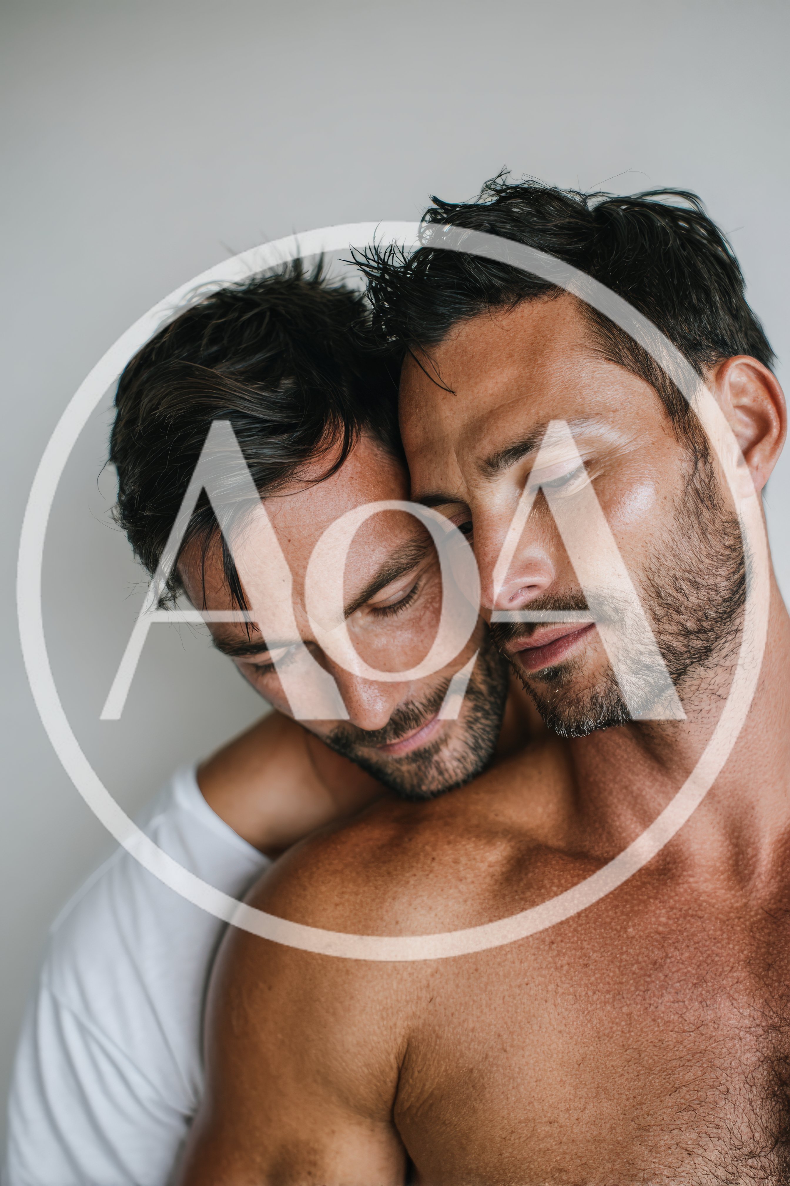 Two Men Embracing With Intimacy And Affection
