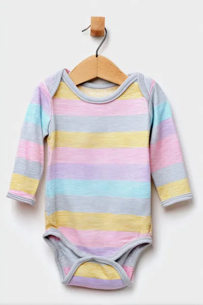 Pastel Striped Baby Bodysuit On A Wooden Hanger