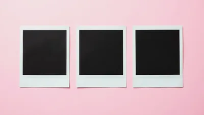 Three Blank Polaroid Frames On A Pink Background