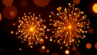 Golden Fireworks Display Against Dark Night Sky
