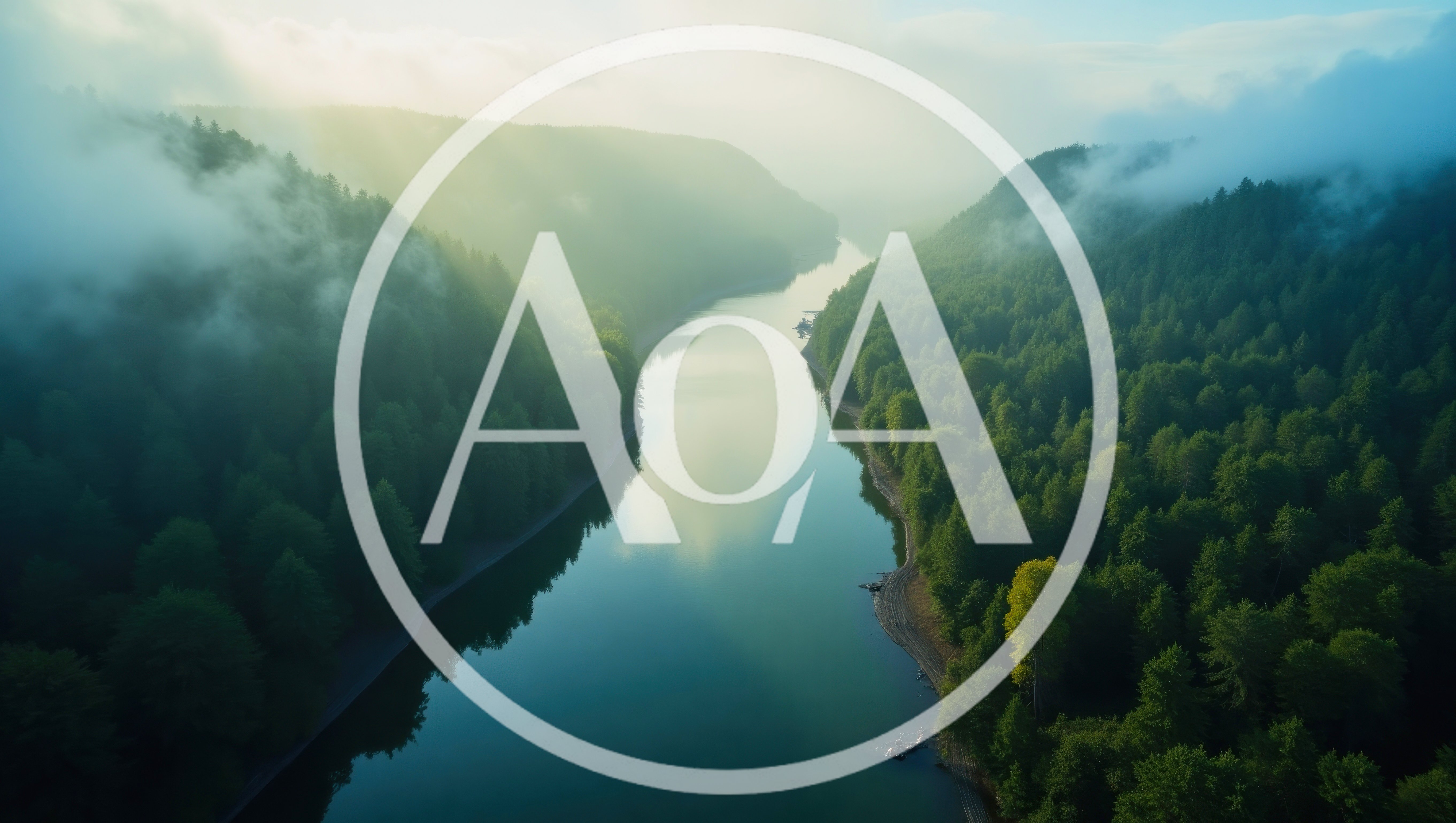 Aerial View Of A Serene River Through Misty Forest