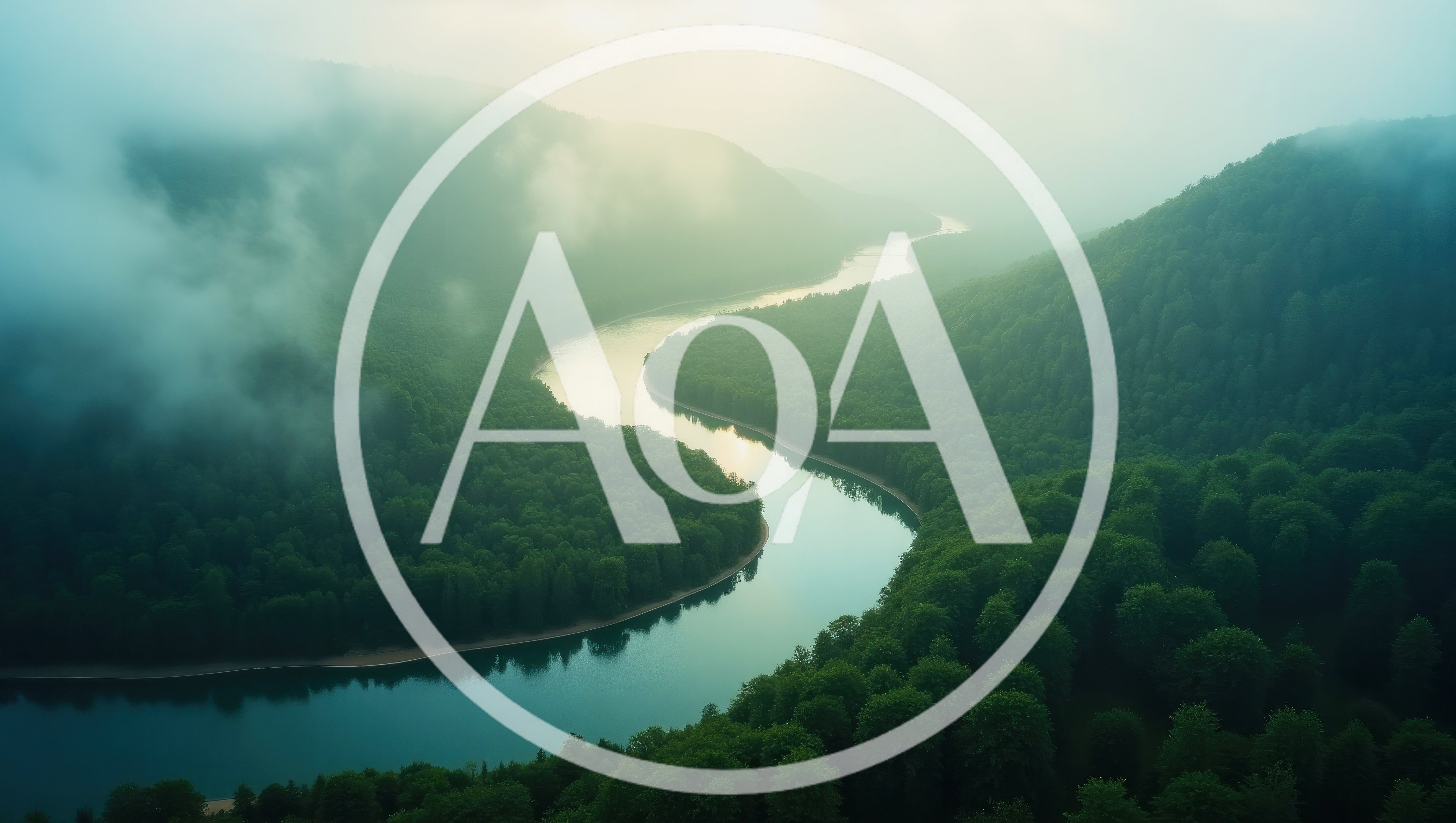 Aerial View Of A Winding River Through Misty Forest