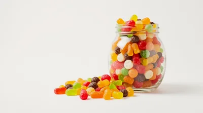 Glass Jar Filled With Colorful Fruit Flavored Gummy Candies