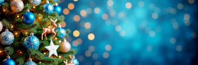 Christmas Tree Decorated With Blue Ornaments And Reindeer