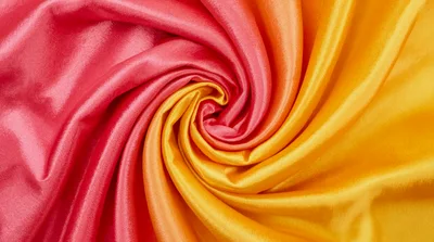 Swirling Pink and Yellow Satin Fabric Texture