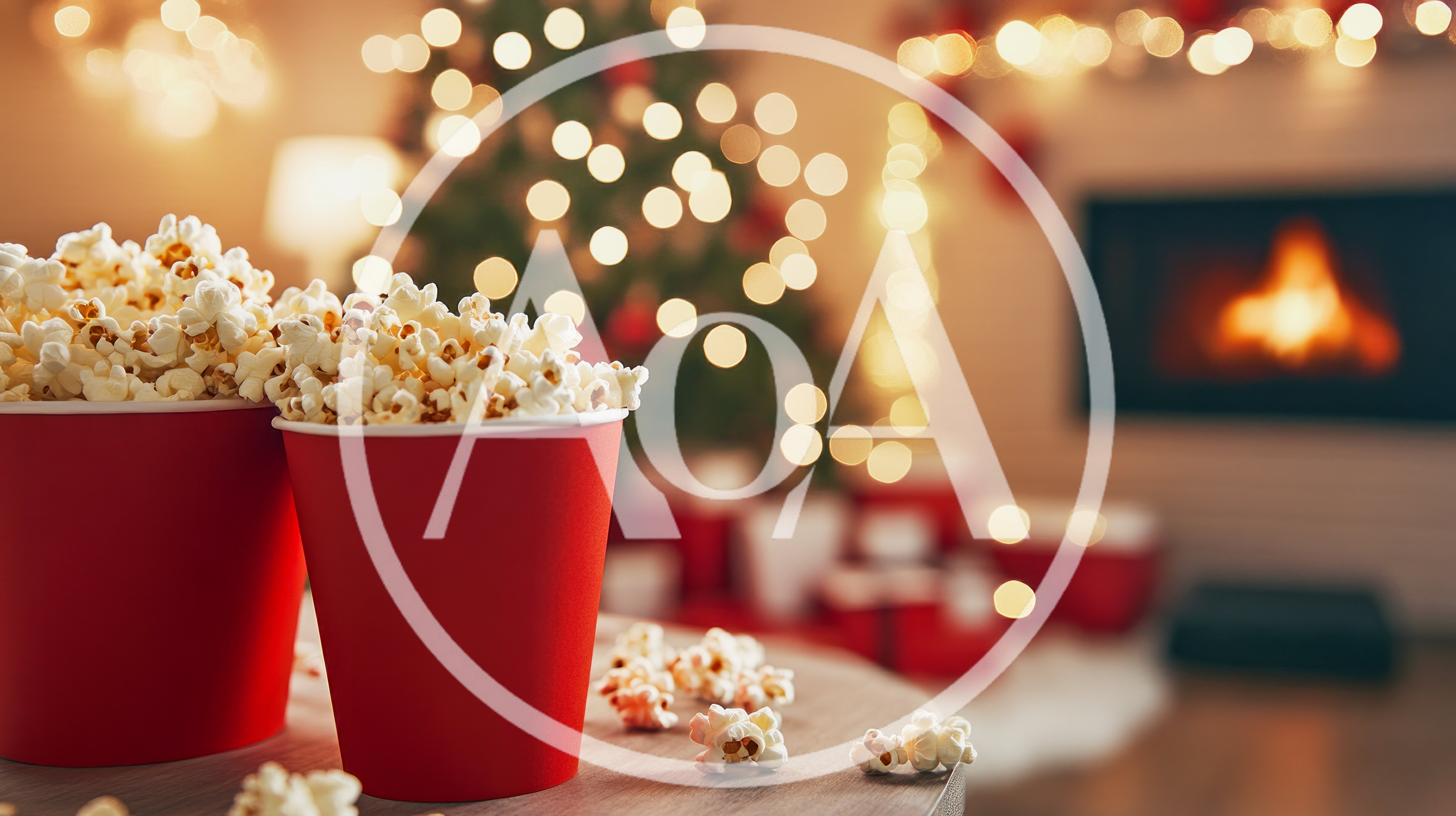 Two Red Popcorn Buckets In A Cozy Christmas Setting