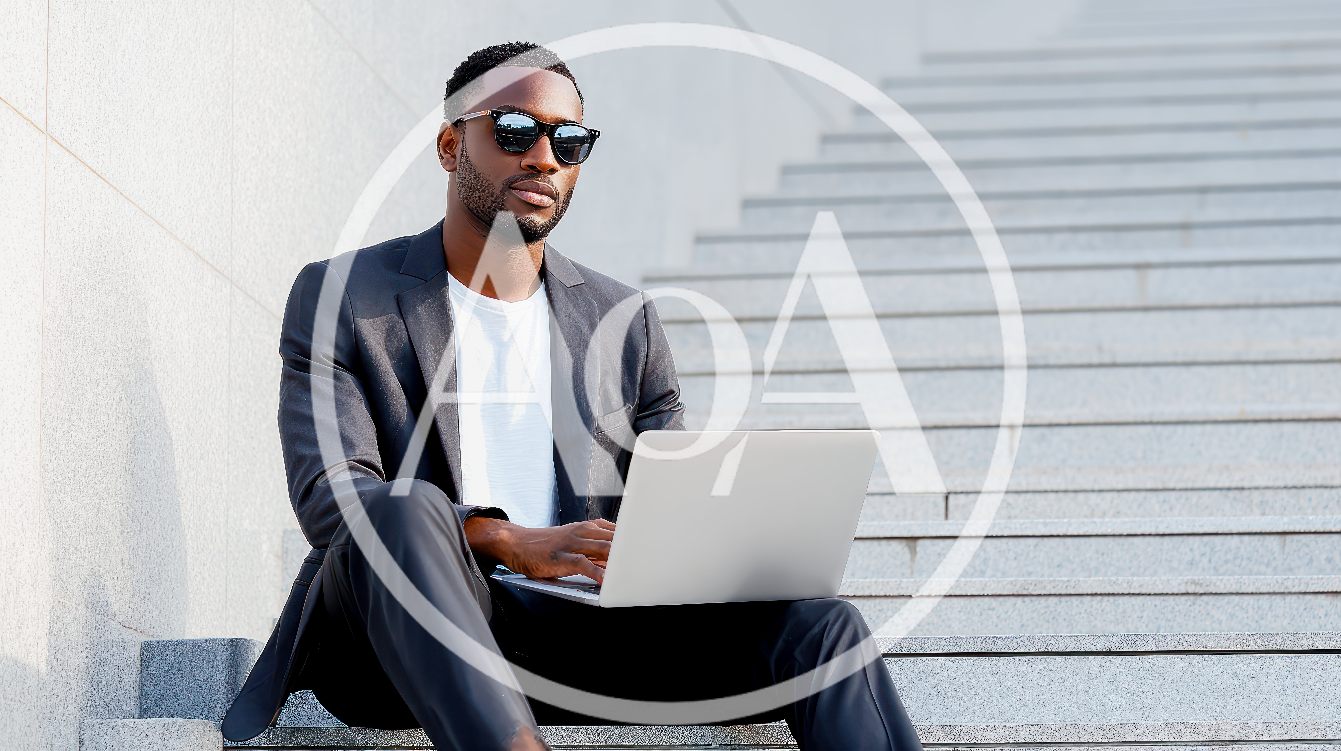 Young Black Businessman Working On Laptop On Outdoor Stairs