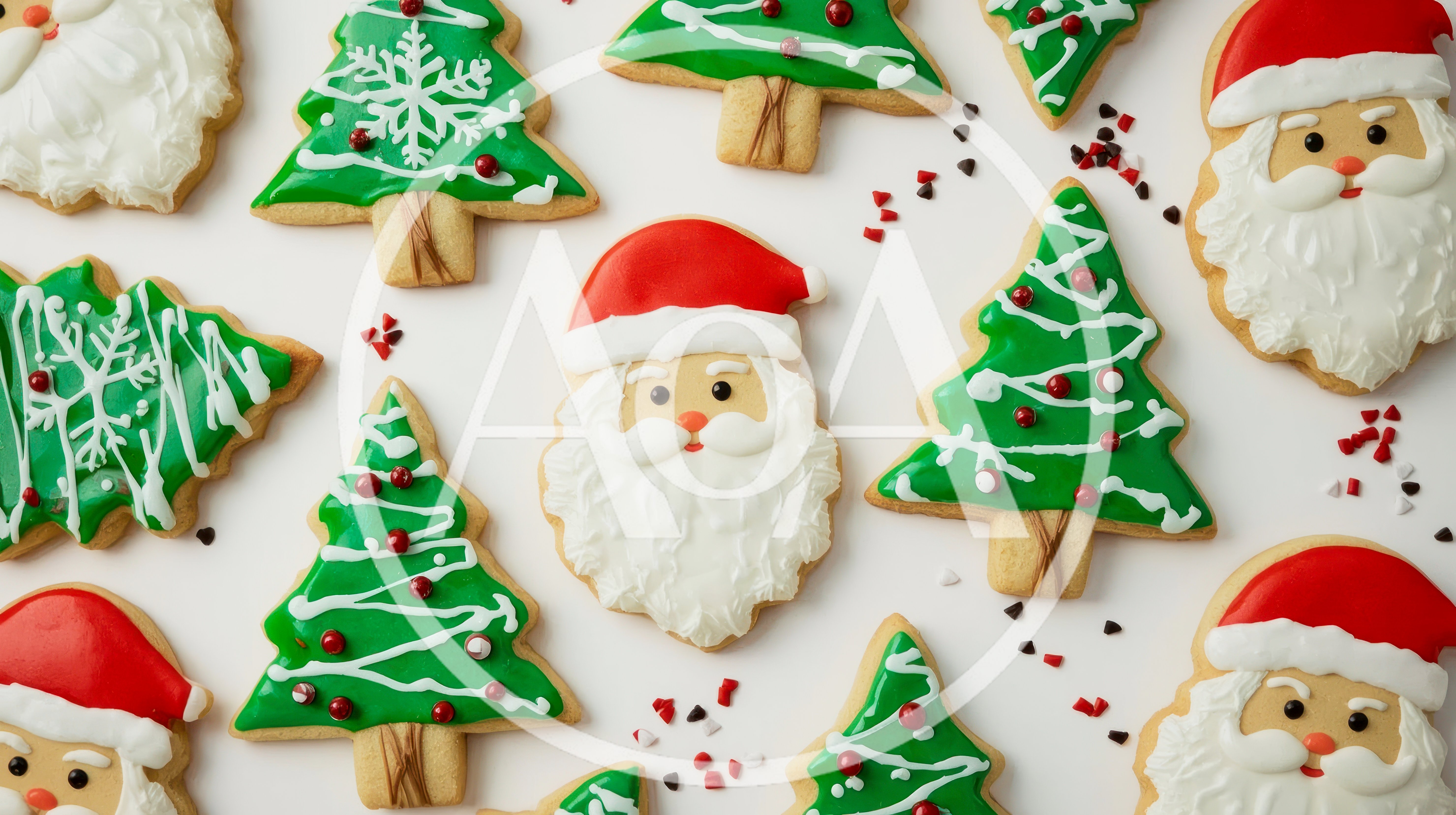 Assorted Christmas Cookies Shaped Like Santa And Trees