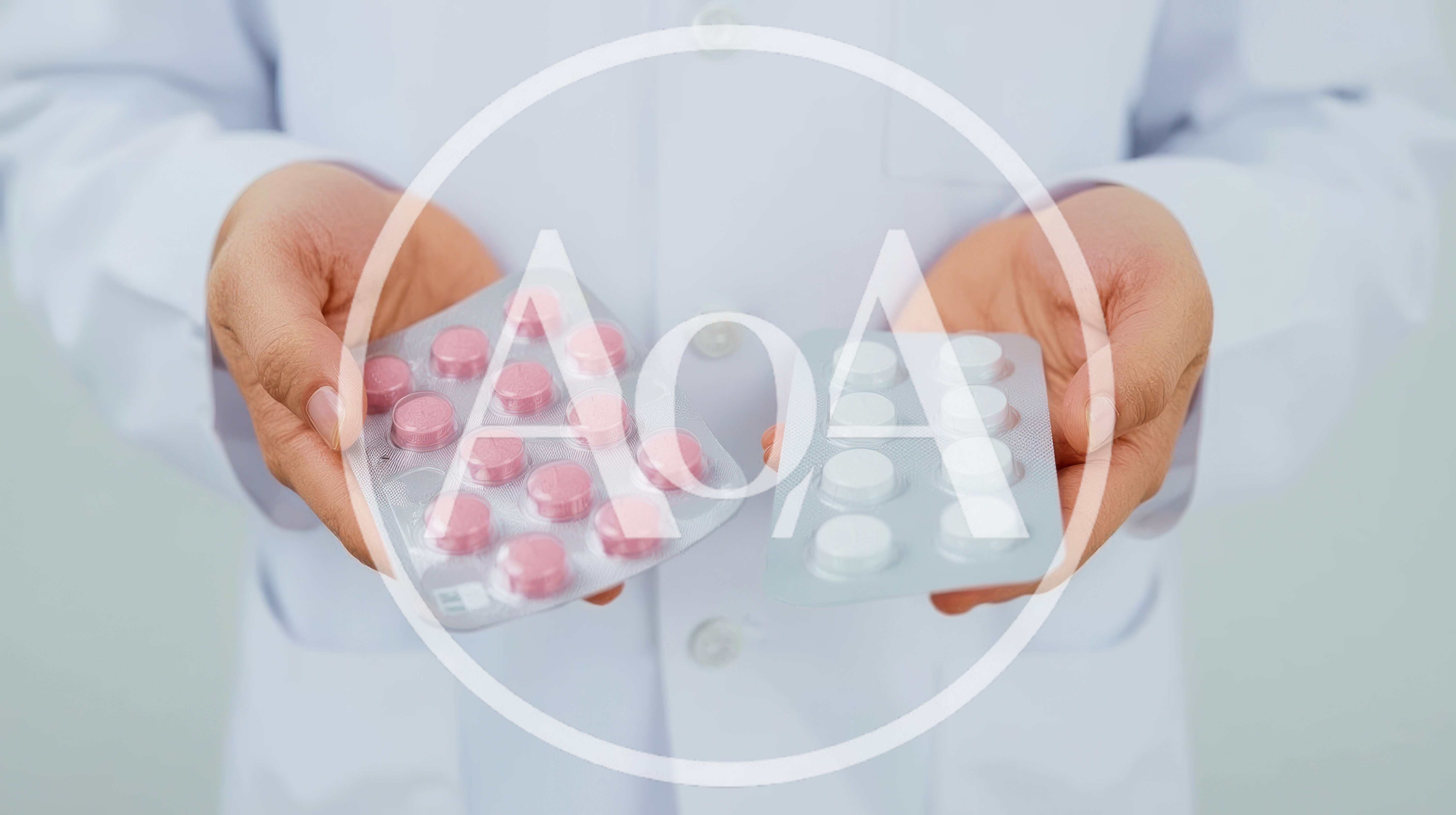 Doctor Holding Blister Packs of Pink and White Pills