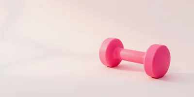 Single Pink Dumbbell on Soft Pastel Background