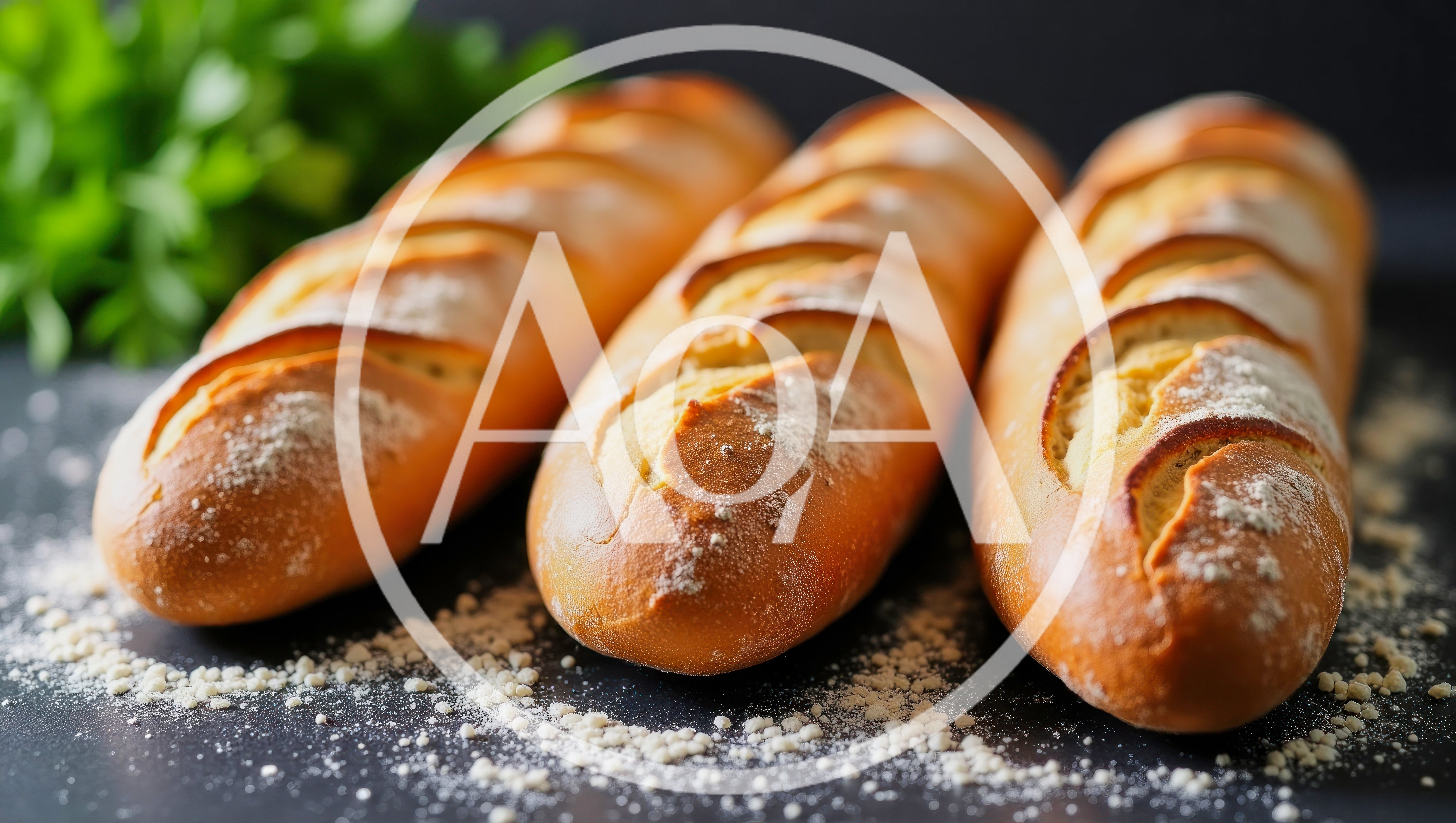 Three Freshly Baked French Baguettes On A Dark Surface