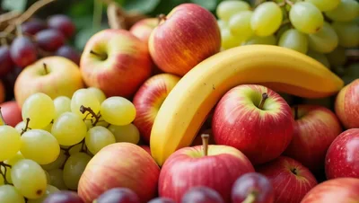Fresh Assorted Fruits Including Apples Bananas And Grapes