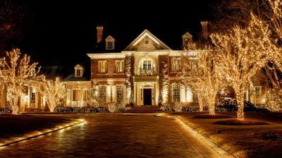 Luxury Mansion Decorated With Christmas Lights At Night