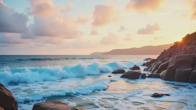 Crashing Ocean Waves Against Rocky Shoreline At Sunset