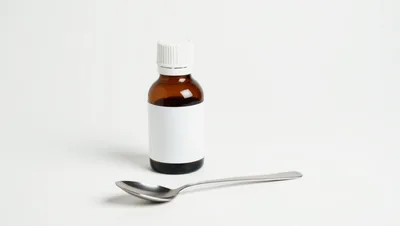 Brown Medicine Bottle With Blank Label And Spoon