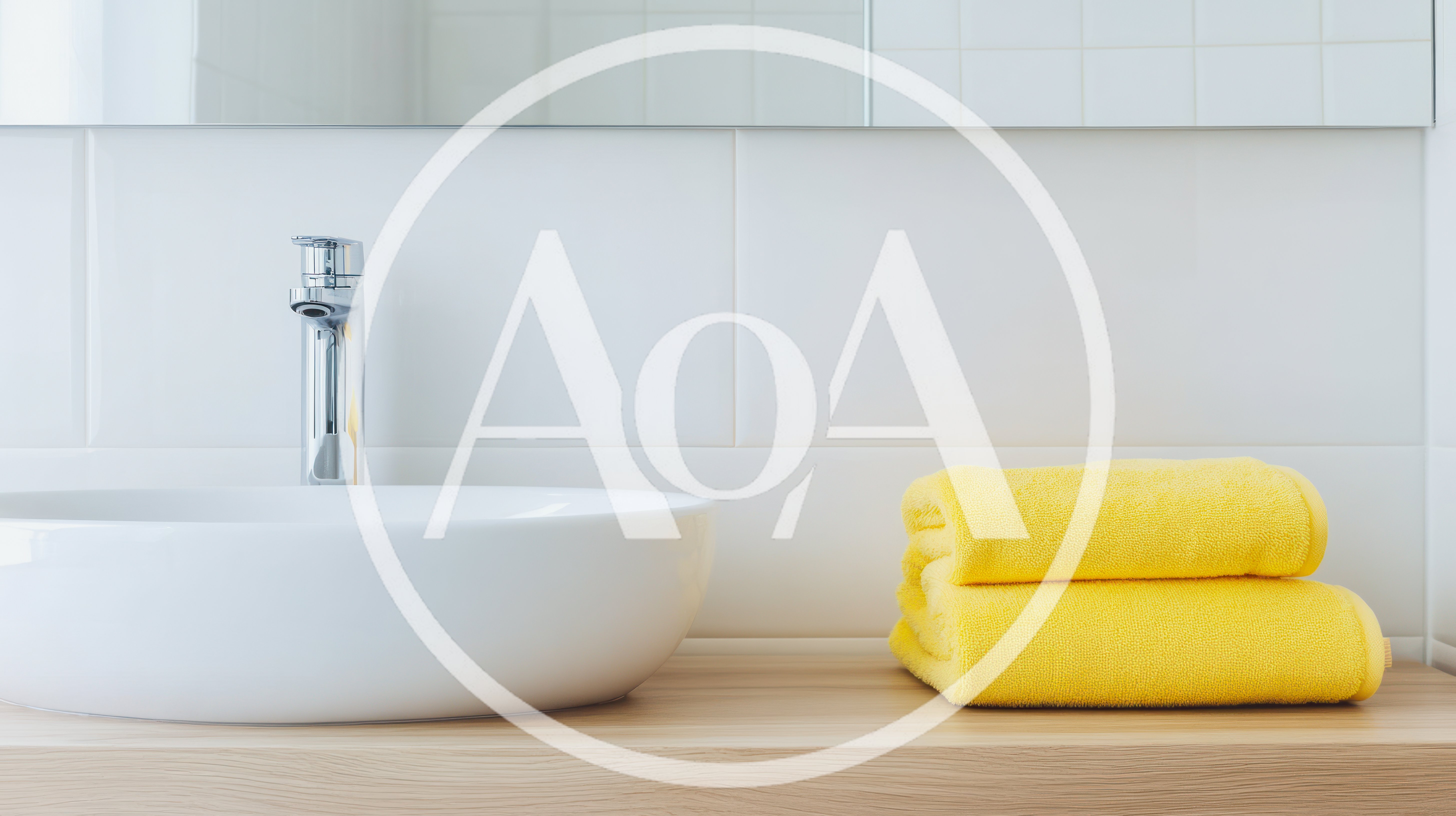 Modern Bathroom Sink With Yellow Towels On Wooden Counter