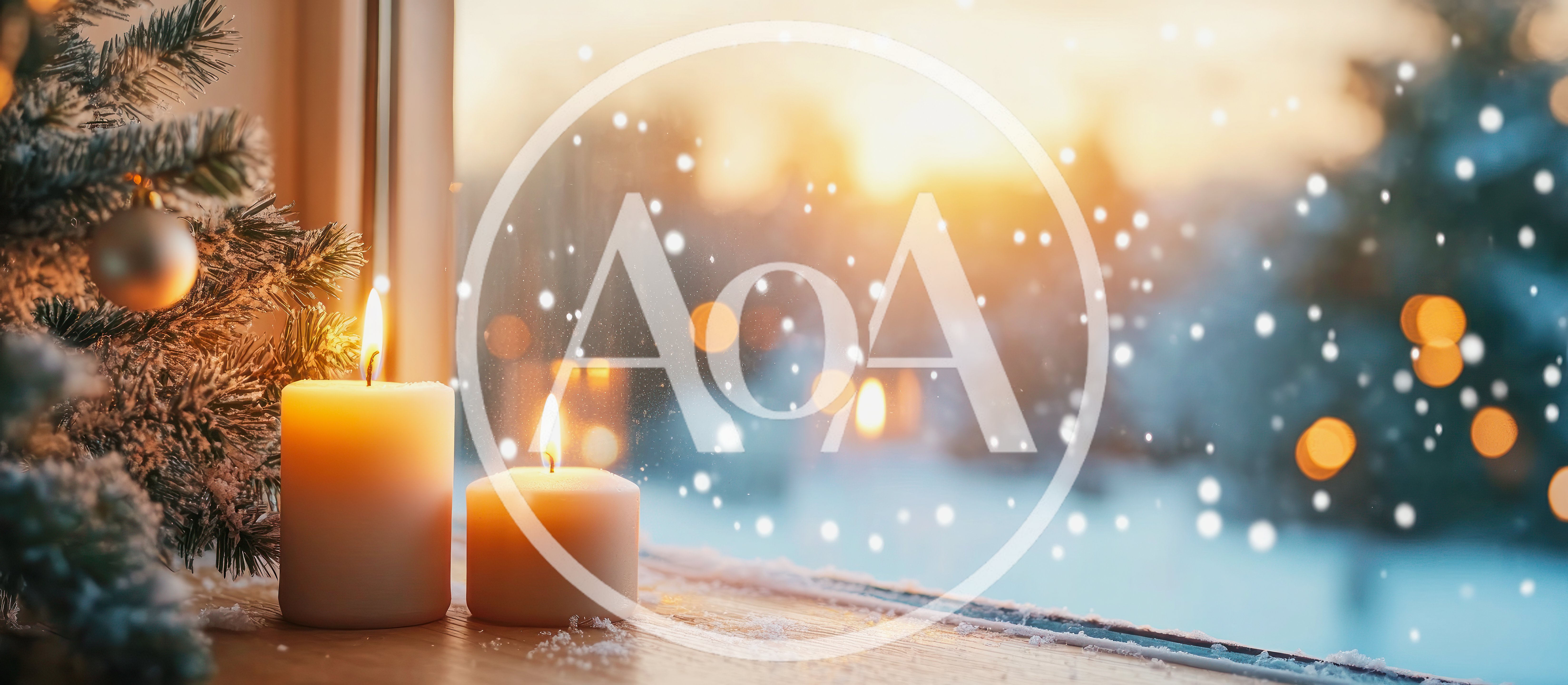 Two Lit Candles Beside A Snowy Christmas Tree