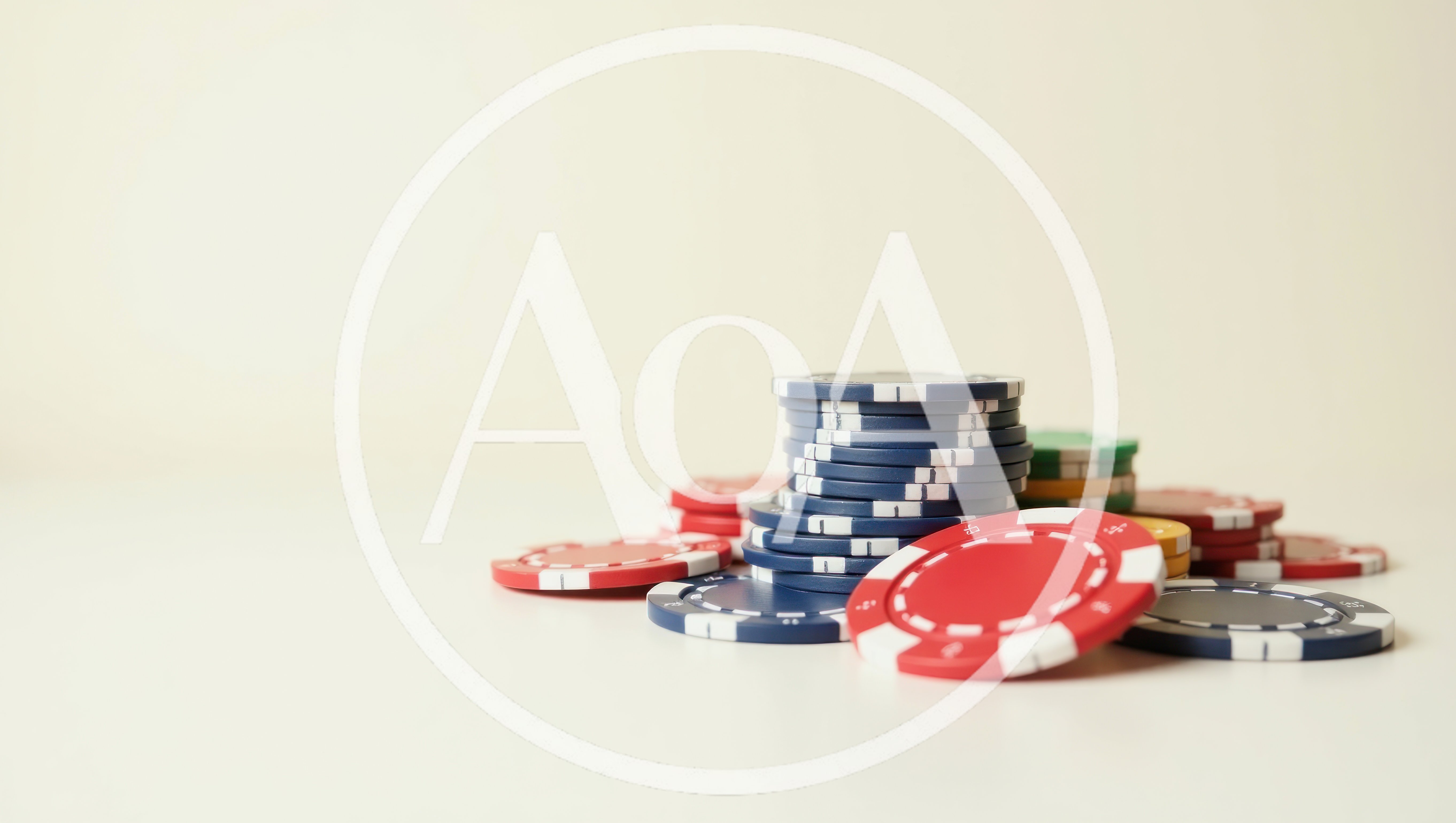Stack Of Colorful Casino Poker Chips On White Surface