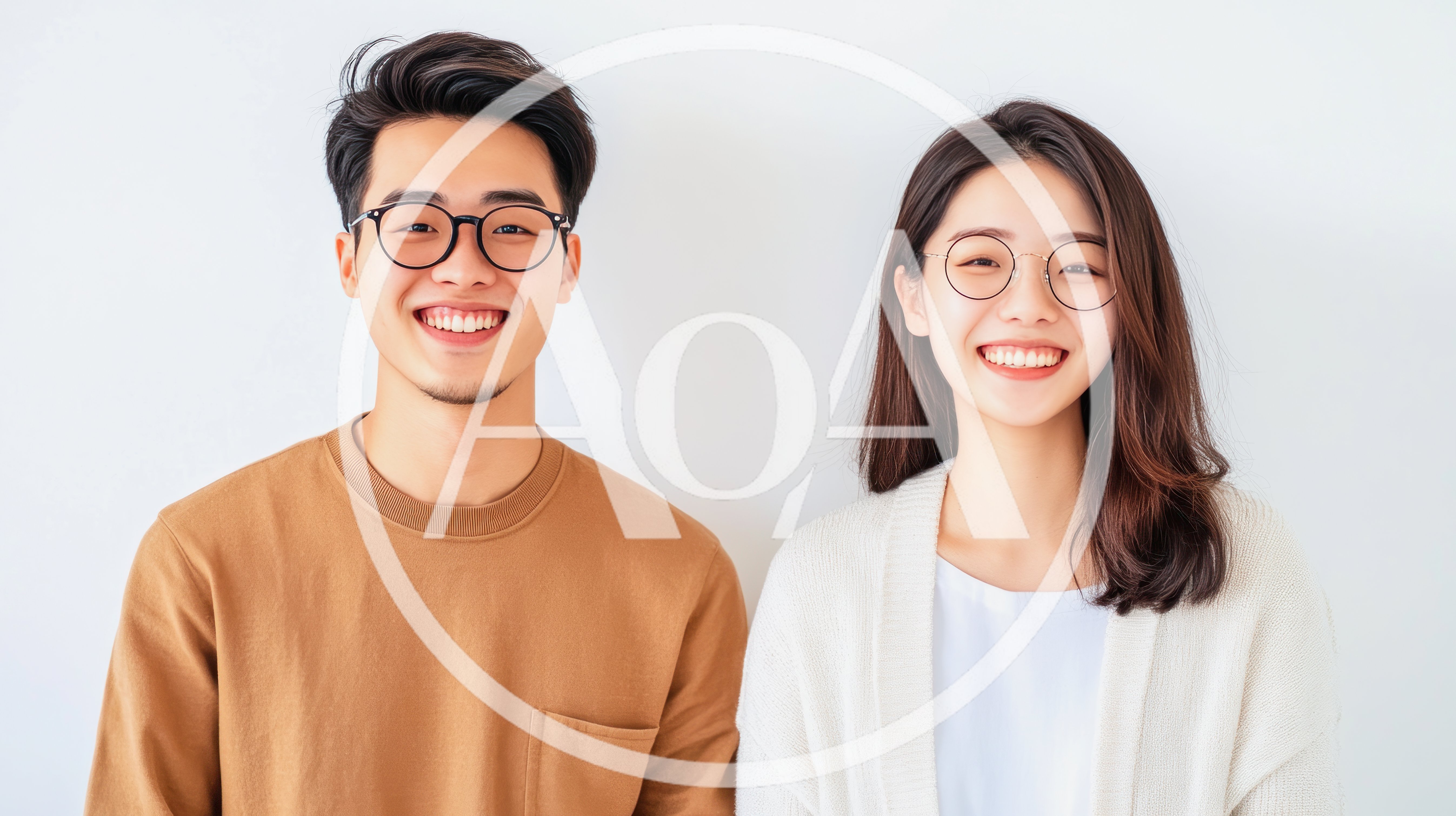 Young Asian Couple Smiling Together Against White Background