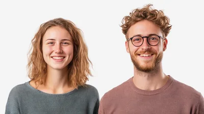 Smiling Young Couple Posing Against White Background