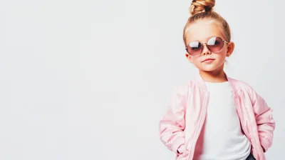 Stylish Little Girl Wearing Pink Bomber Jacket and Sunglasses