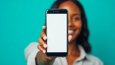 Young Woman Holding Smartphone With Blank Screen
