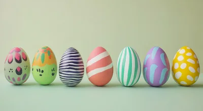 Seven Colorful Decorated Easter Eggs In A Row