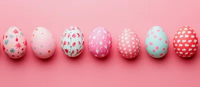 Row Of Decorative Easter Eggs On Pink Background