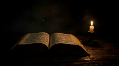 Open Ancient Book Illuminated By A Single Candle