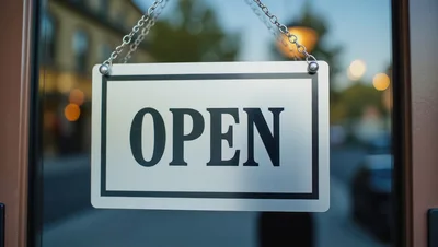 Open Sign Hanging on a Glass Storefront Door