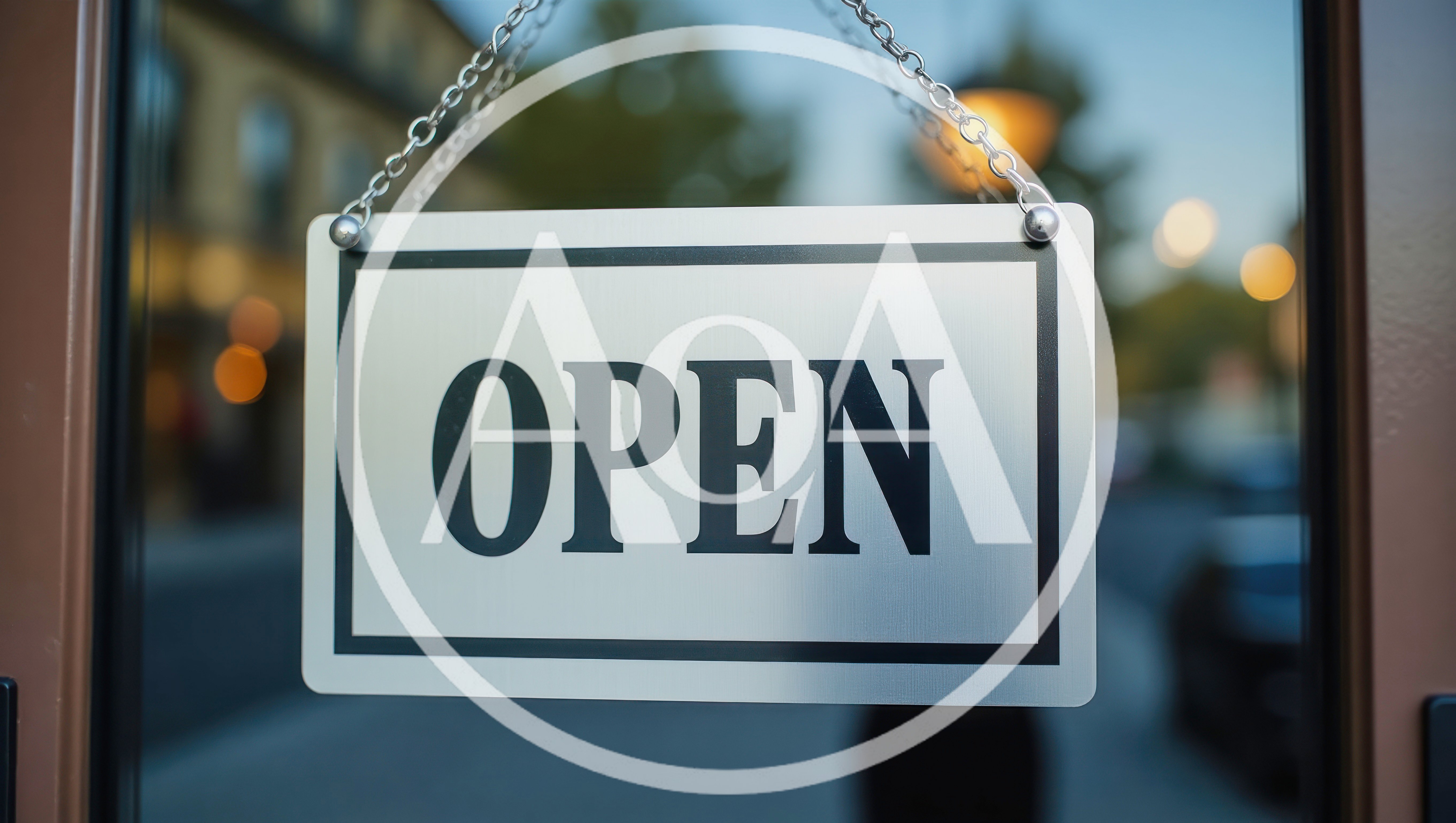Open Sign Hanging on a Glass Storefront Door