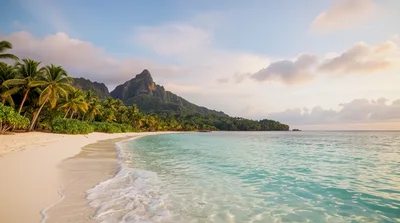 Tropical Beach Shoreline With Lush Mountain Backdrop