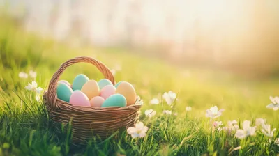 Easter Eggs In A Woven Basket On Grass