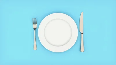 Empty White Plate With Fork And Knife