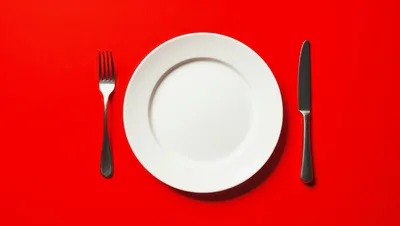 Empty White Plate With Fork And Knife