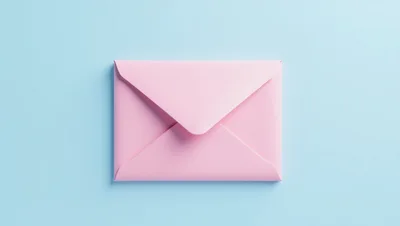Pink Envelope Centered on a Light Blue Background