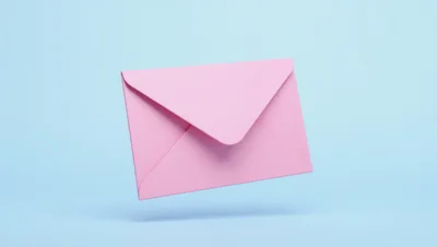 Floating Pink Envelope on Pastel Blue Background