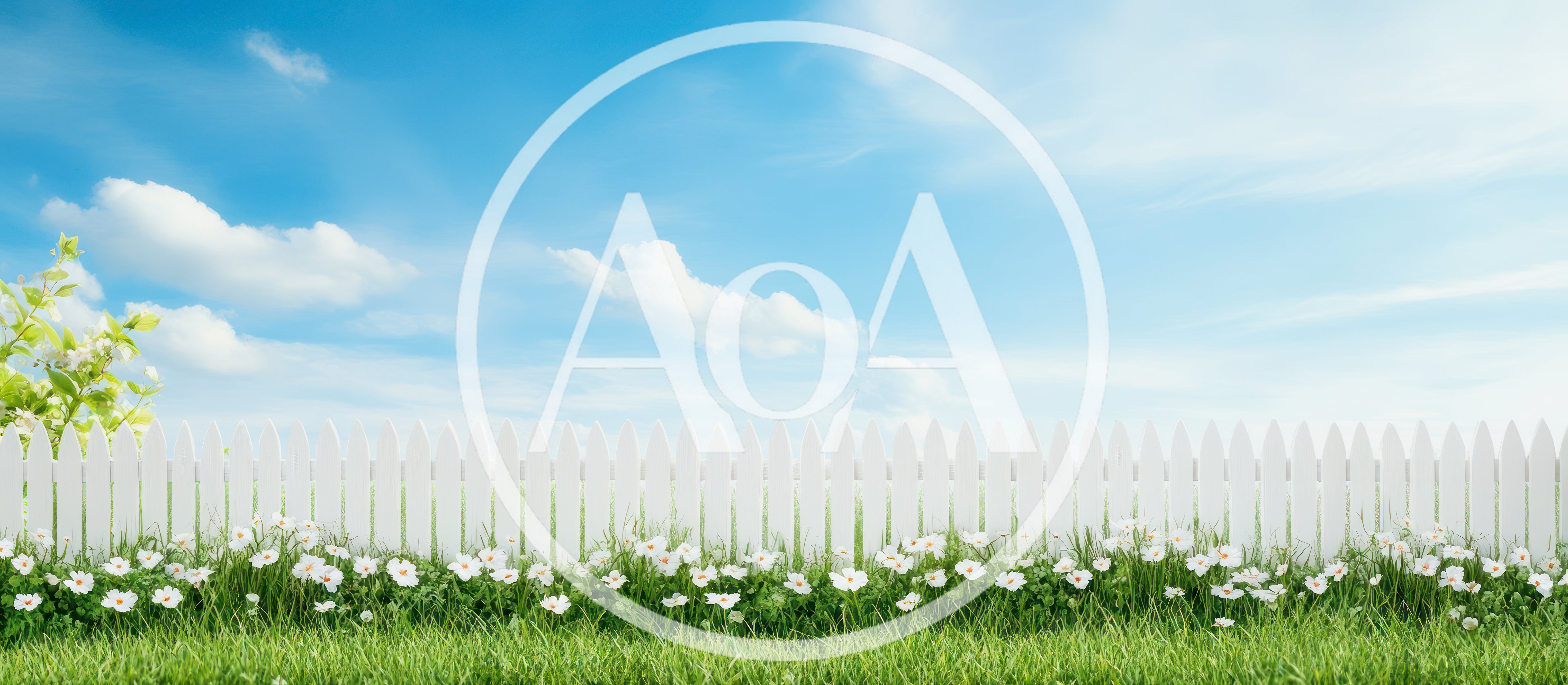White Picket Fence With Flowers And Green Grass