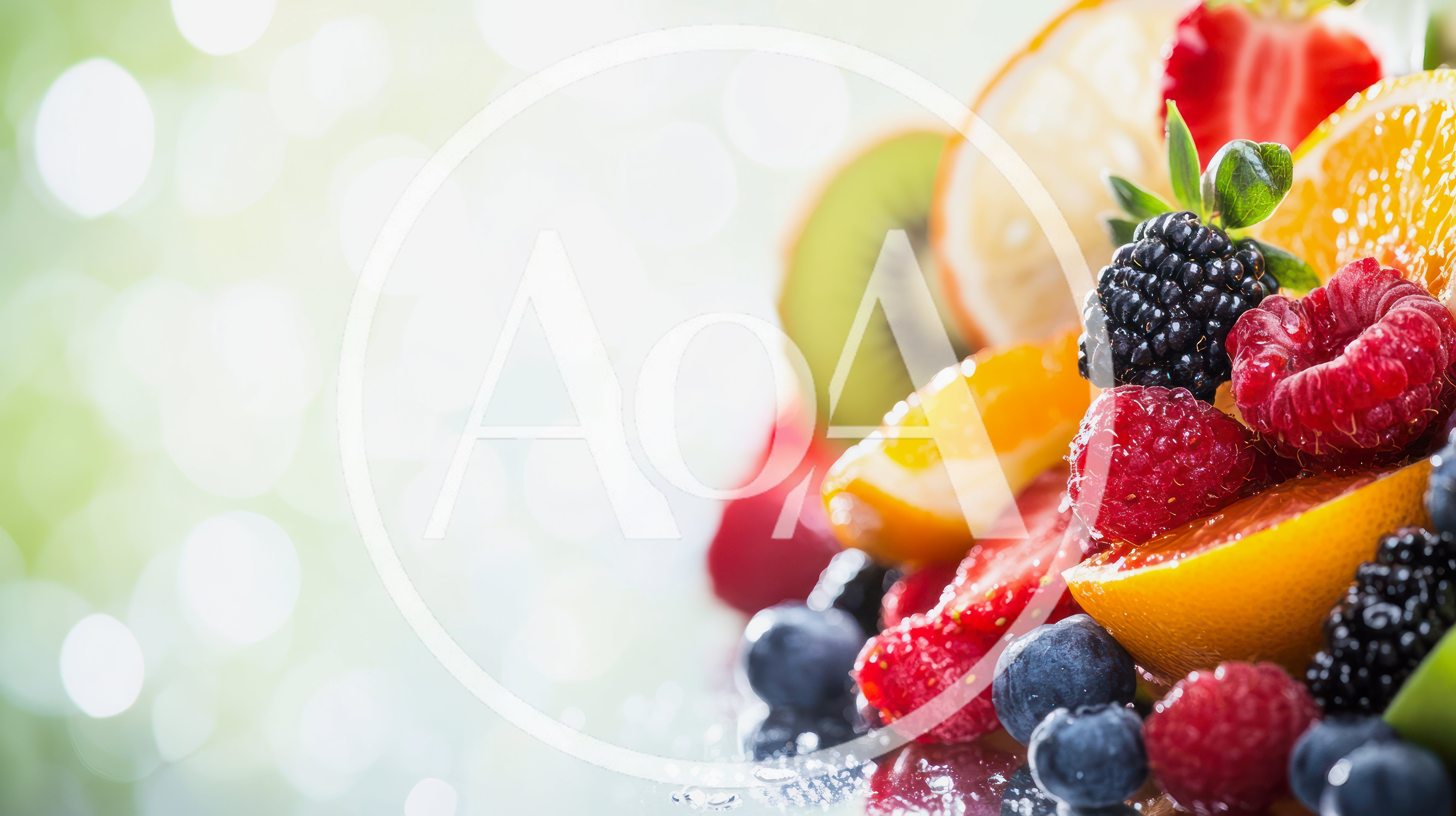 Fresh Assorted Fruits And Berries On Reflective Surface