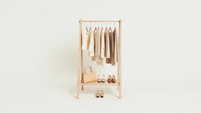 Minimalist Clothing Rack With Neutral Toned Apparel And Accessories