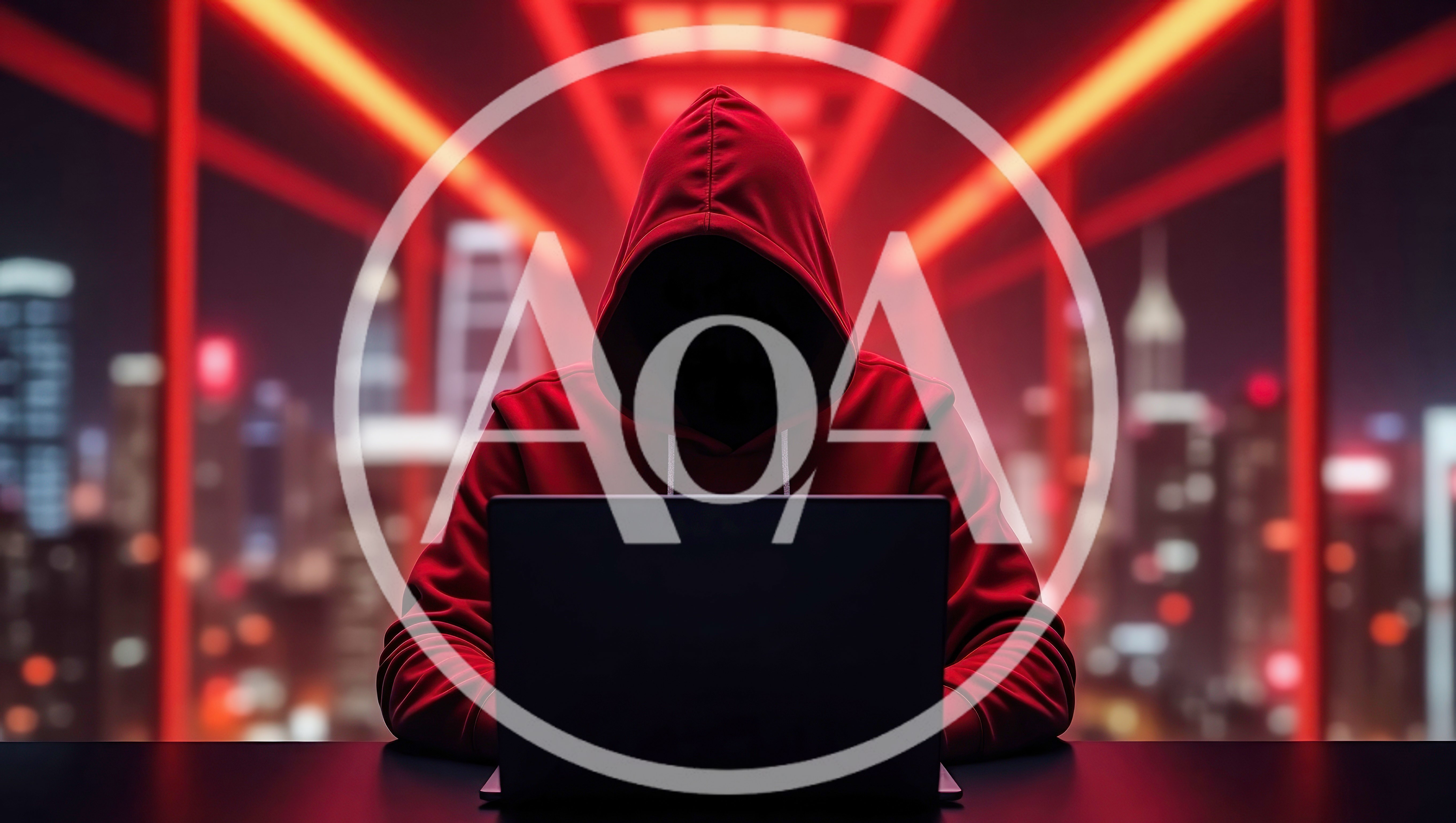 Anonymous Hacker In Red Hoodie Working On Laptop
