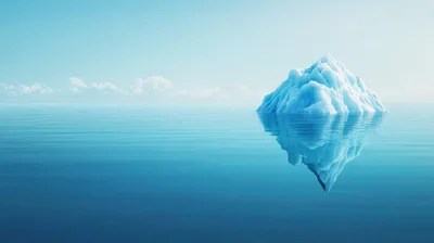 Single Iceberg Floating In Calm Blue Ocean
