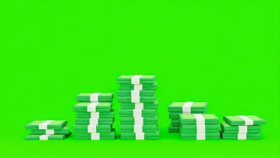 Stacks Of Green Paper Money On Green Screen