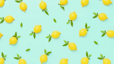 Pattern of Yellow Lemons on Light Blue Background