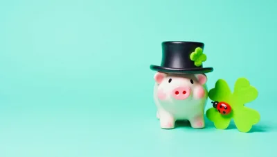 Piggy Bank Wearing A Leprechaun Hat With Clover