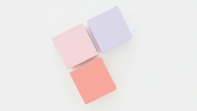 Three Pastel Colored Cubes On White Background