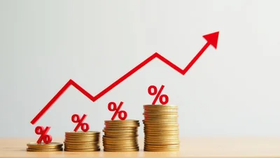Rising Interest Rates Concept With Gold Coins And Percent Signs