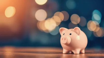 Pink Piggy Bank On Wooden Table With Bokeh Background